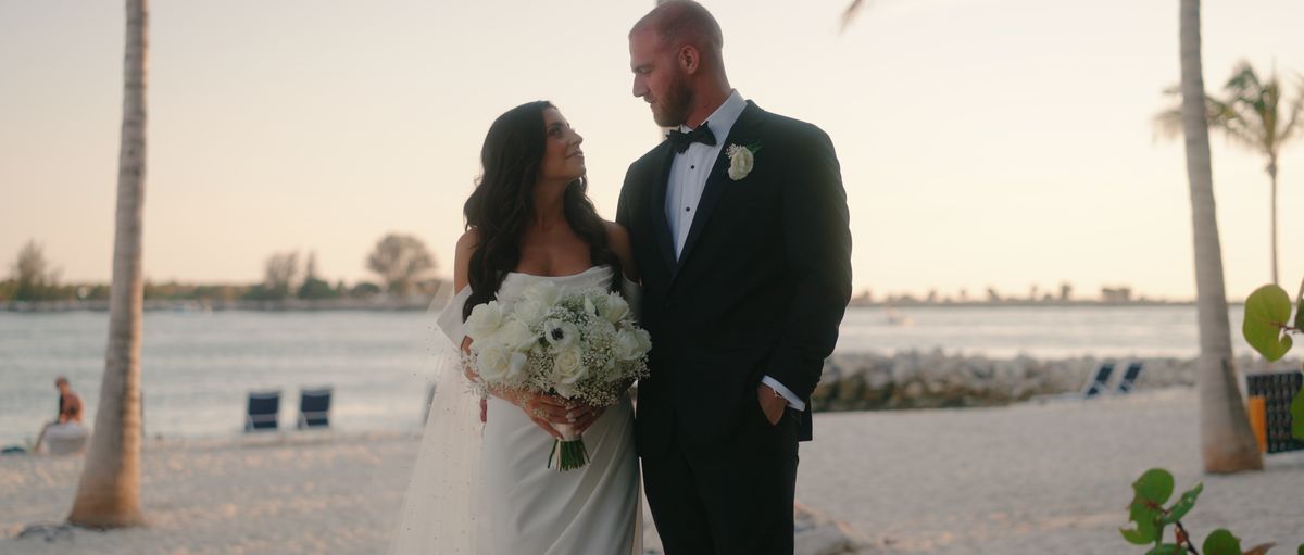 Alyssa and Sean on the beach at sunset